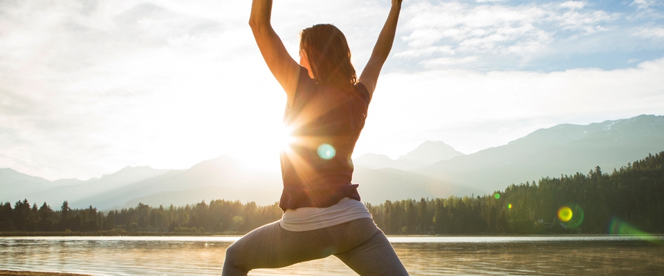 Holmes Place | outdoor sun salute exercise yoga woman sun