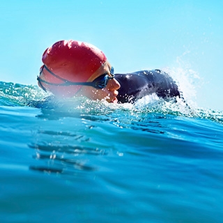 Holmes Place | Person Swimming in the Ocean