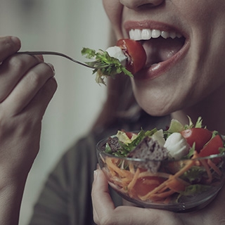 Holmes Place | Woman eating salad