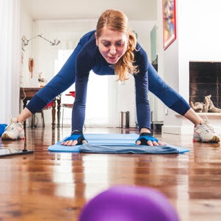 Holmes Place | woman indoor yoga mat floor exercise