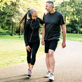 Middle age couple exercising | Holmes Place