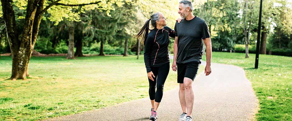 Middle age couple exercising | Holmes Place