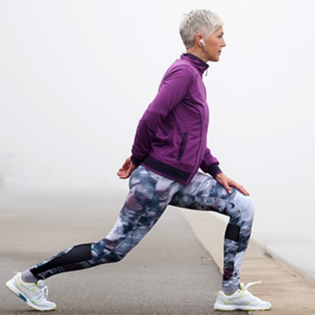 holmes place | woman stretching