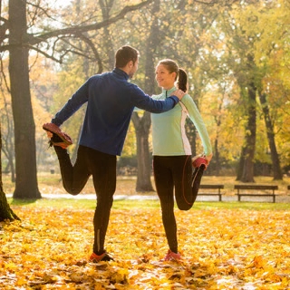 Holmes Place | Man and Woman Stretching