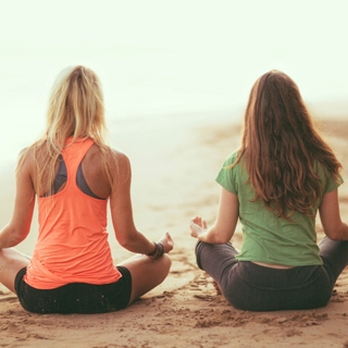 Holmes Place | Women doing yoga