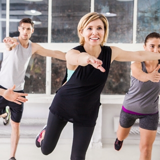 indoor gym class women laugh fun fitness | Holmes Place